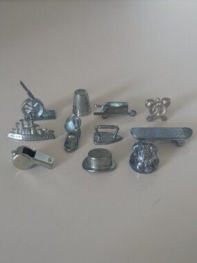 Lot of eleven monopoly pieces including the sought-after skateboard!